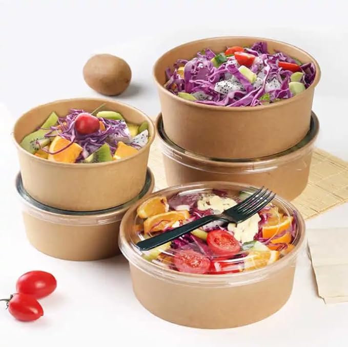 Disposable round kraft paper bowls with lids, ideal for salads and deli takeaway, showcasing various colorful foods.