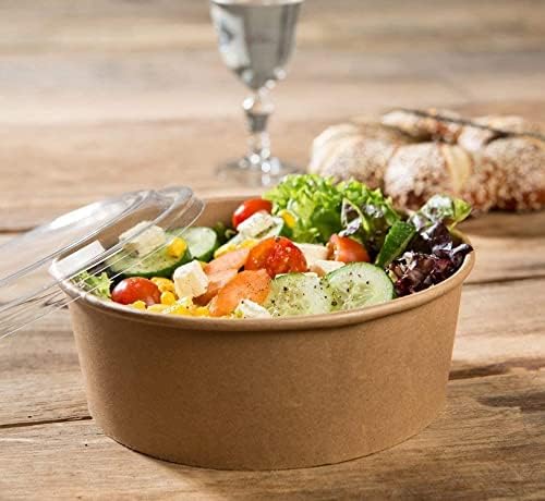 Disposable round kraft paper bowl with salad, clear lid, perfect for takeaways and street food.